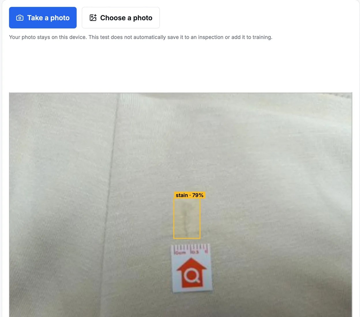 Example of a garment photo with an AI-highlighted area for defect review